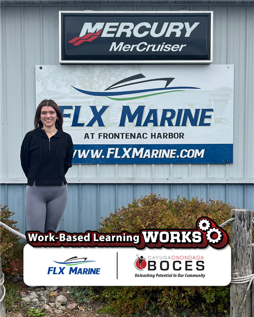  Natalie Pyle poses in front of FLX Marine sign